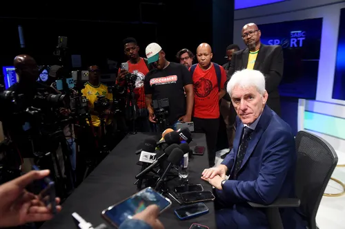 Hugo Broos addressing the media