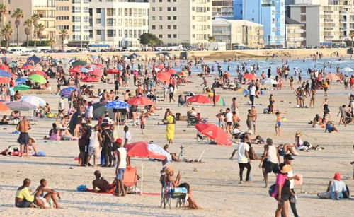 People cooling off at Strand beach during the heatwave