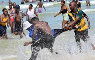 Monwabisi Beach Residents cool off during heatwave