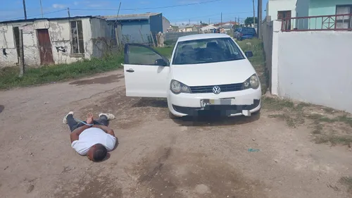 Police arresting a suspect in Gqeberha