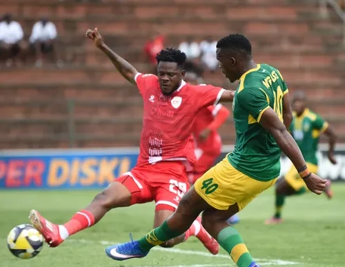 Lungelo Nguse of Lamontville Golden Arrows takes on the TS Galaxy defence