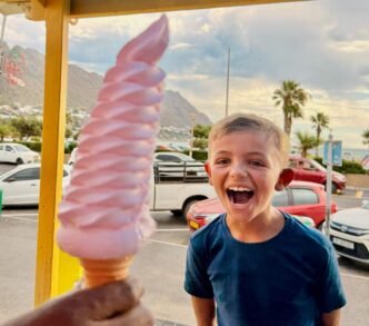 Family enjoying ice cream on the beach