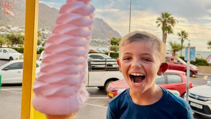 Family enjoying ice cream on the beach
