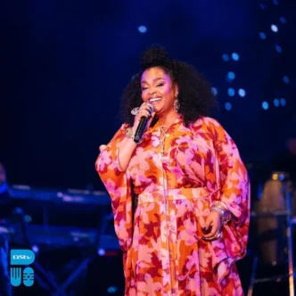 Jill Scott performing on stage