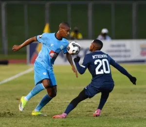 Fezile Gcaba of Durban City is challenged by Richards Bay's Moses Mthembu