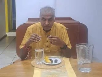 Pat Reddy breaking his fast with dates and water