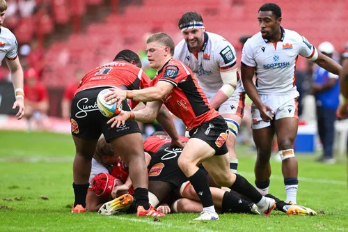 Lions players celebrating a try