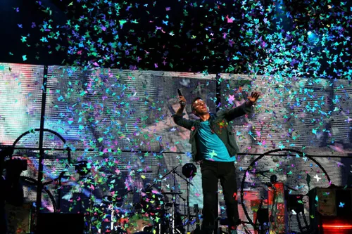 Coldplay performing live on stage