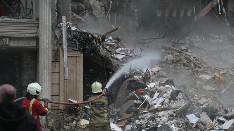 Destroyed building in a residential area after strikes on Iran in Tehran