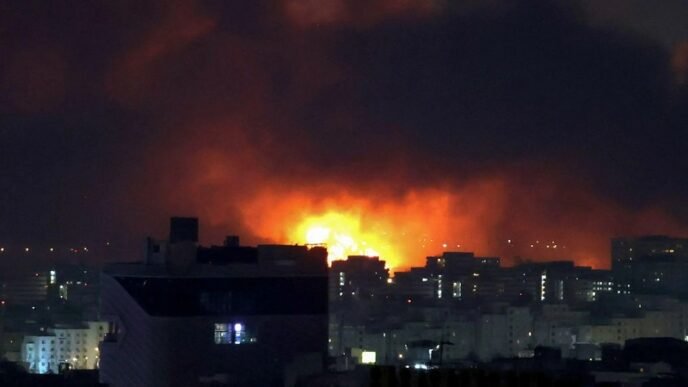 Smoke and fire rise from the site of airstrikes at Mehrabad International Airport in Tehran