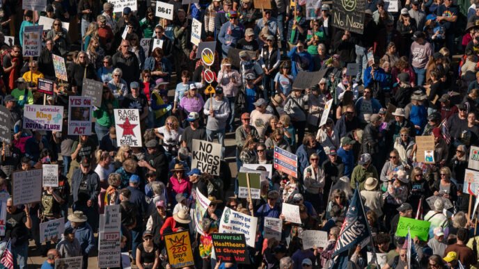 Protesters marching with signs