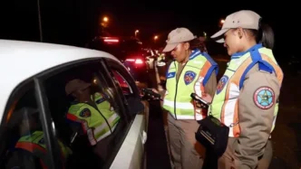 KZN Road Traffic Inspectorate officers speaking to a motorist