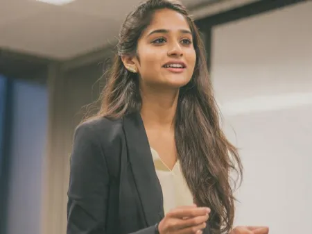 Woman speaking up in a meeting