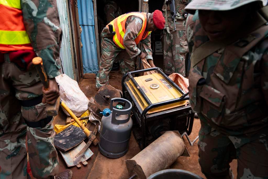 SANDF soldiers conducting door-to-door searches