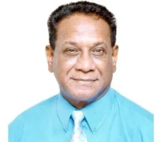 Dr Guru Kistnasamy holding his book, The Guru Guide