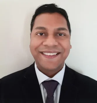 Photo of a person collecting water from a contaminated source