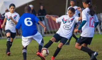 Youth football players in action during the Cape Town Super 7s tournament