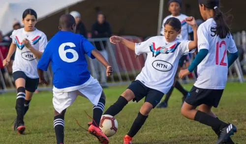 Youth football players in action during the Cape Town Super 7s tournament
