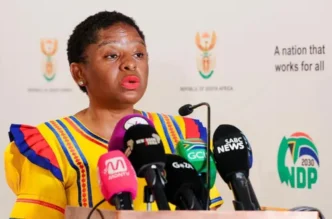 Minister Khumbudzo Ntshavheni briefing the media