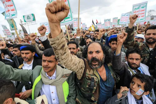 Protesters in the Middle East holding signs against the conflict