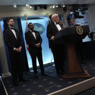 Donald Trump speaking at a podium