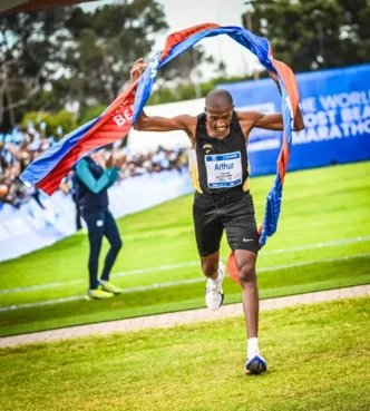 Arthur Jantjies crossing the finish line at the Two Oceans Marathon