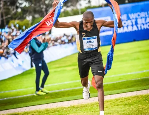 Arthur Jantjies crossing the finish line at the Two Oceans Marathon