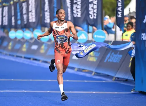 Mohamed Esa crossing the finish line