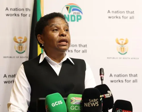 Minister Khumbudzo Ntshavheni speaking at a press conference