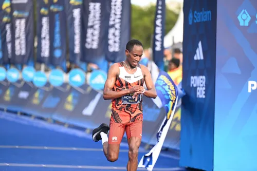 Mohamed Esa crossing the finish line