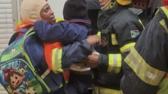 Fire truck rescuing children from flooding