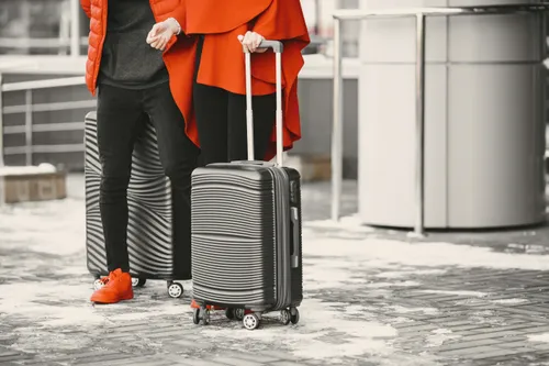 baggage handler placing cushion on carousel