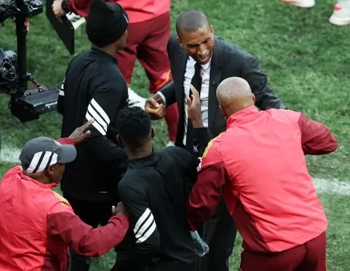 Orlando Pirates head coach Abdeslam Ouaddou celebrates with his staff