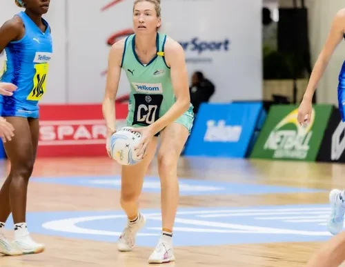 Netball players in action during a match
