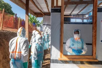 Medical experts in protective gear treating Ebola patients