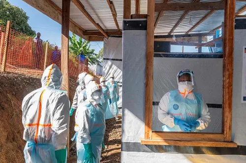 Medical experts in protective gear treating Ebola patients